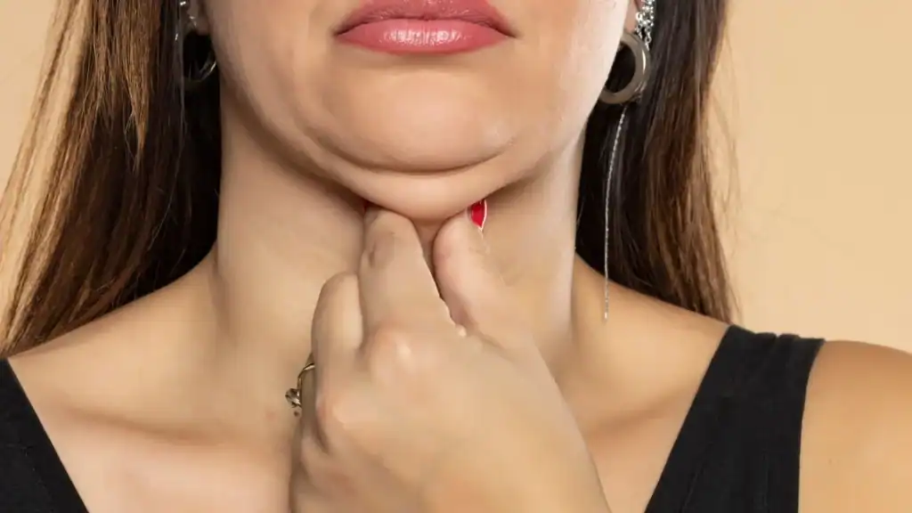 An image of a woman with double chin, sad, worried : Non Surgical Double Chin Removal Treatment in Handsworth Wood, UK